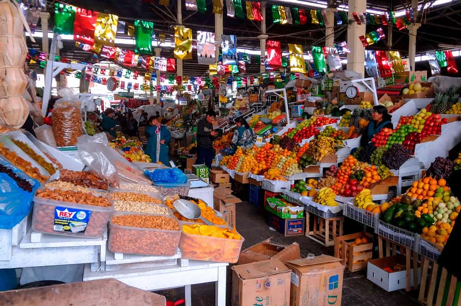 Cusco: Planetarium and Night Tour with Dinner and Pisco Sour - San Pedro Market: Andean herbs, fruit, and practical local food-watching