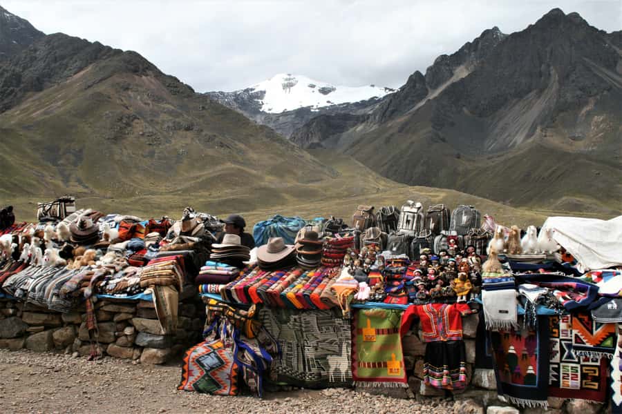 From Cusco: Full-Day Touristic Bus to Puno with Guided Tours - Raya Pass at 4,335 m: Views, Pools, and Quick Souvenir Time