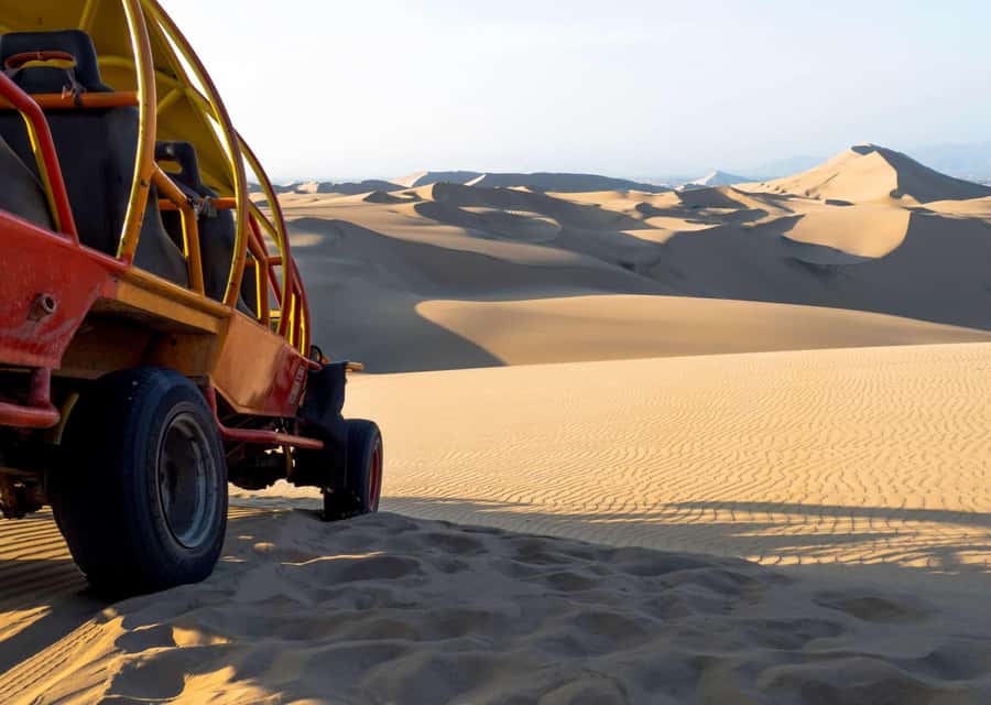 From Huacachina: Sandboarding and Dune Buggy Tour + Income - Sunset up on the dunes and that “Oasis of America” photo moment