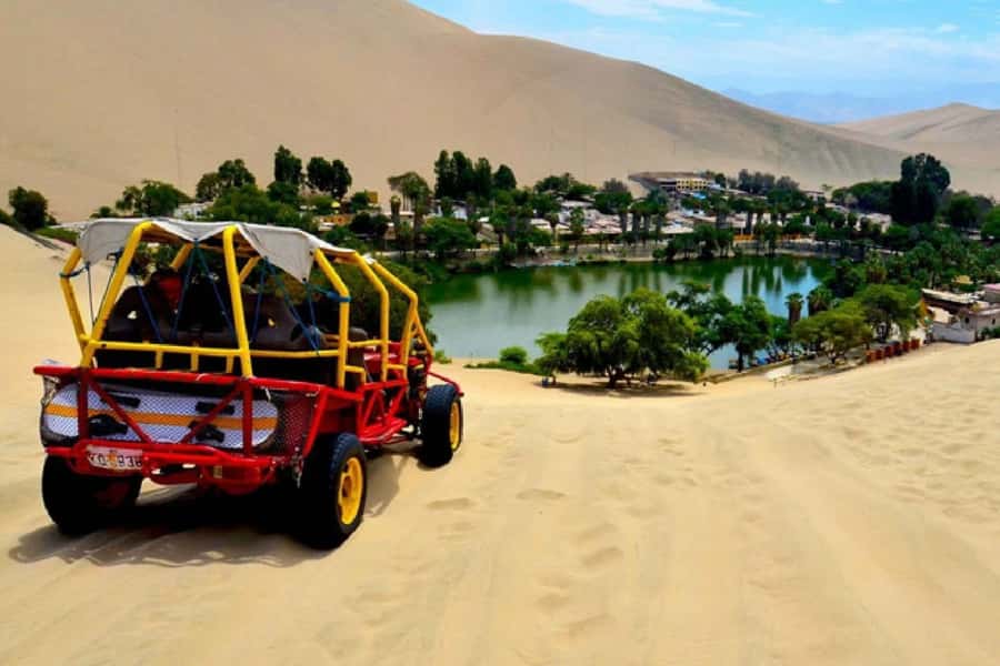 From Lima: Full Day Tour (Paracas + Huacachina) - Ballestas Islands by boat: penguins, sea lions, and dramatic rock shapes
