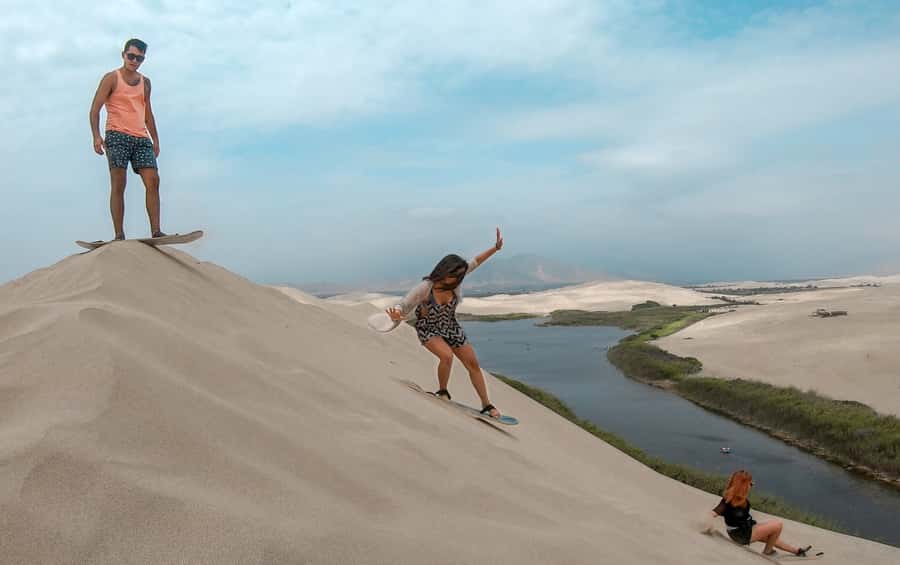 From Paracas: Mini Buggy Tour & Sandboarding at Oasis - Language and Group Comfort: English or Spanish Instruction