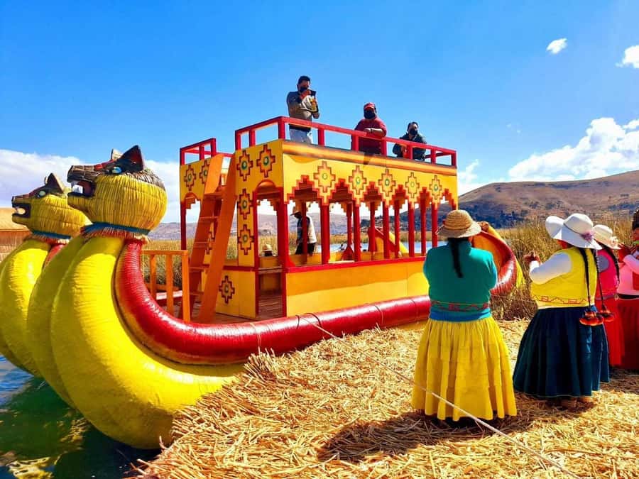 From Puno: Excursion to Uros and Taquile Islands + Income - First Stop: Uros Floating Islands and Totora Life
