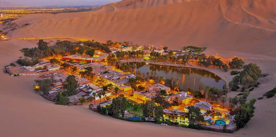 Lima: Paracas and the Huacachina Oasis Guided Day Tour - Huacachina oasis: dune buggy thrills and sandboarding the desert way